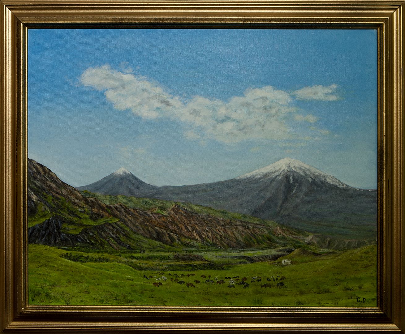 Two snow-capped volcanic peaks, a large one and a smaller one beside it, rising beyond green pastures where a herd grazes, under a blue sky with white clouds.